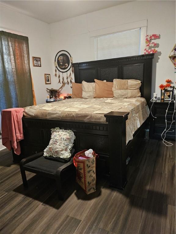 bedroom with wood-type flooring