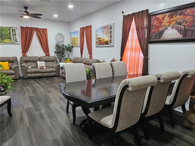 dining area with ceiling fan and dark wood-type flooring