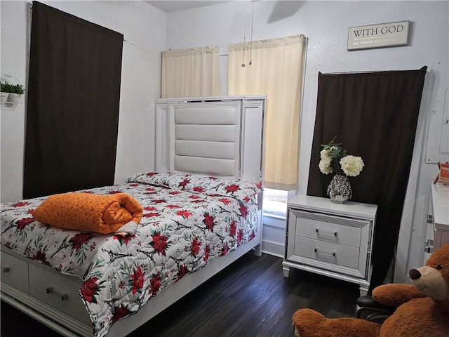 bedroom featuring dark hardwood / wood-style flooring