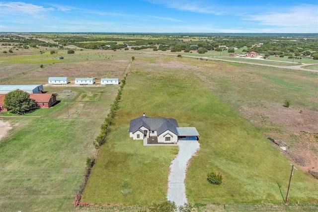 birds eye view of property with a rural view