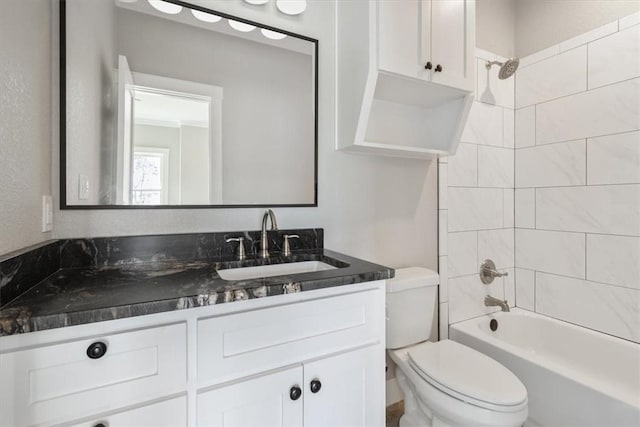 full bathroom featuring vanity, toilet, and tiled shower / bath