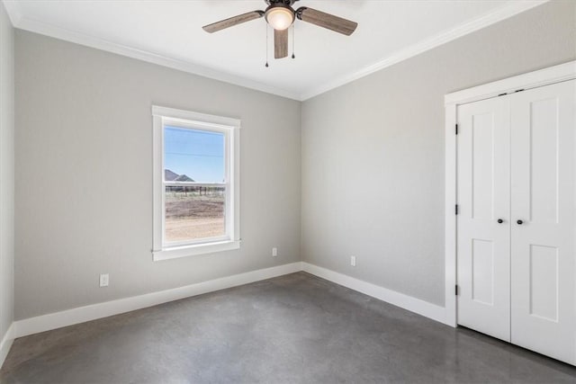 spare room with crown molding and ceiling fan