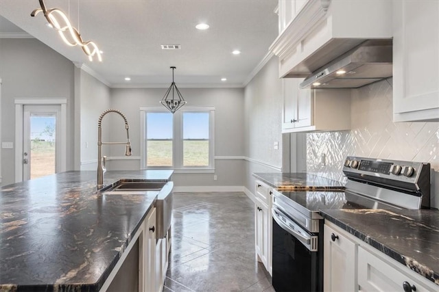 kitchen with stainless steel range with electric stovetop, white cabinets, hanging light fixtures, and range hood