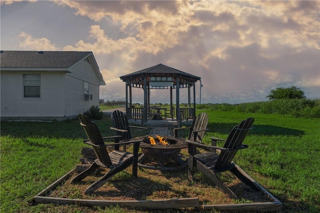 view of yard with a gazebo and an outdoor fire pit