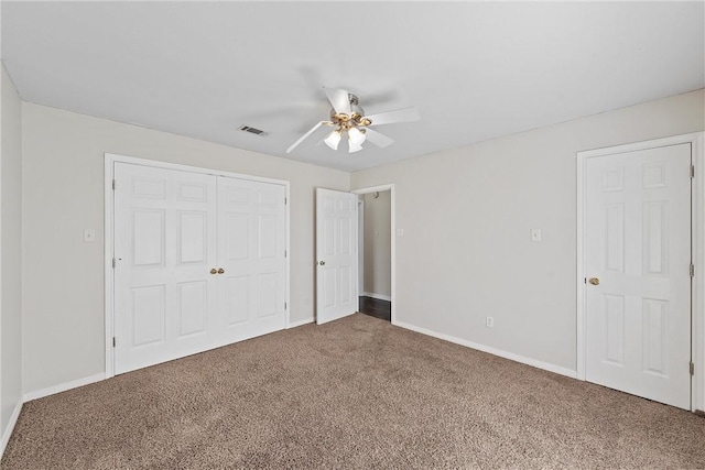 unfurnished bedroom featuring carpet flooring and ceiling fan