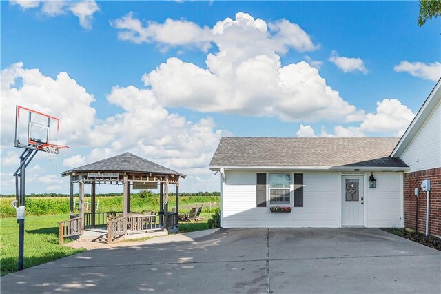 view of front of home featuring a front yard and a gazebo