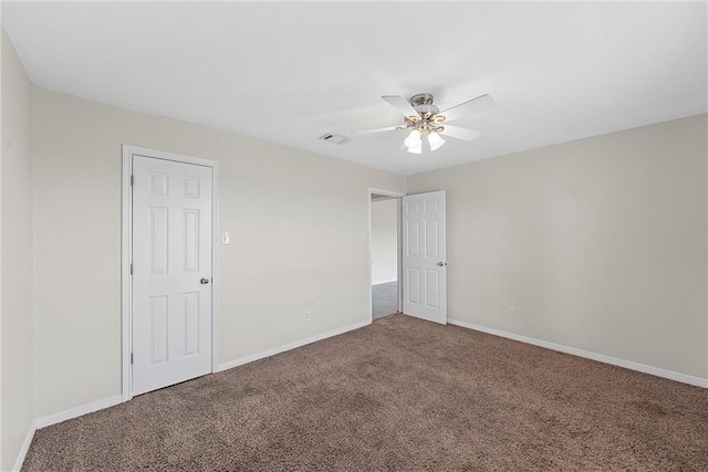 spare room with carpet and ceiling fan