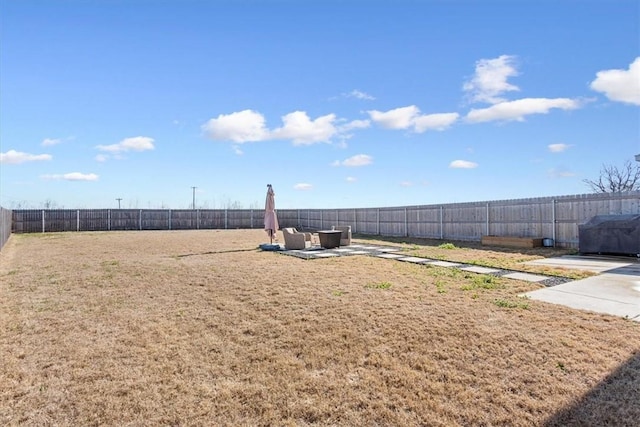 view of yard featuring a patio area and a fenced backyard