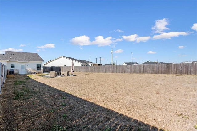 view of yard with a fenced backyard