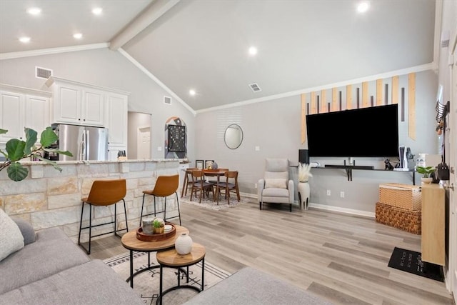 living room with light wood-type flooring, baseboards, visible vents, and ornamental molding