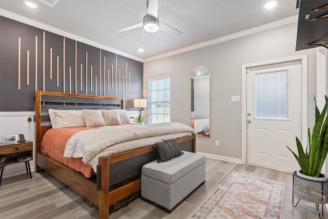 bedroom with crown molding, recessed lighting, baseboards, and light wood-style floors