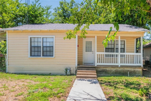 view of front of house featuring a porch and a front lawn