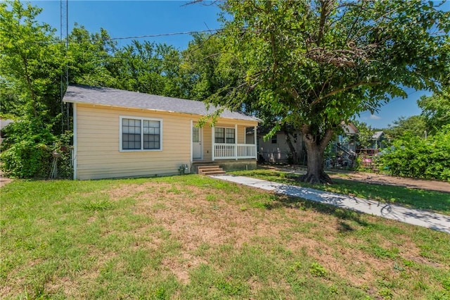 view of front of home with a porch and a front lawn