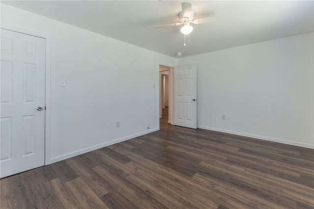 unfurnished room with ceiling fan and dark hardwood / wood-style floors