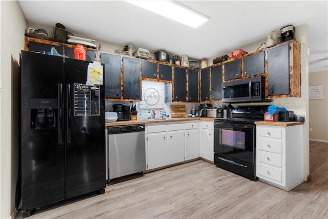 kitchen featuring white cabinets, sink, light hardwood / wood-style floors, and black appliances