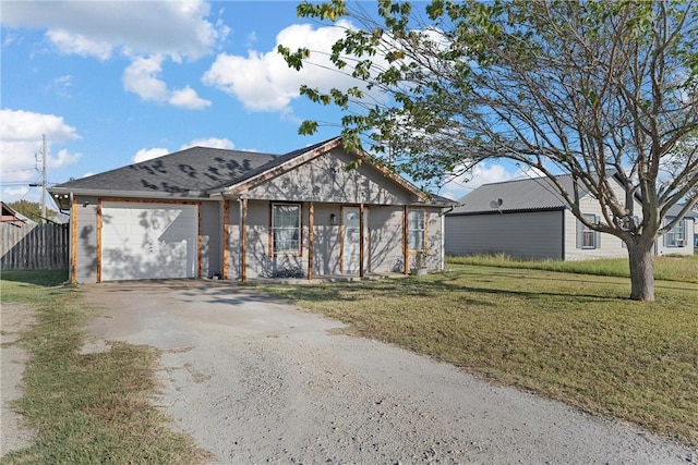 ranch-style house with a front yard and a garage