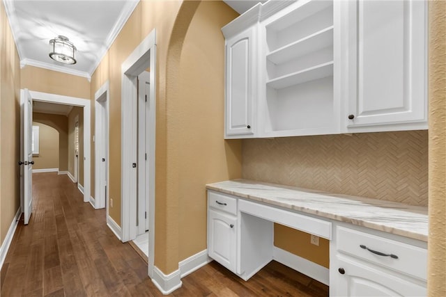 interior space with crown molding and dark hardwood / wood-style flooring