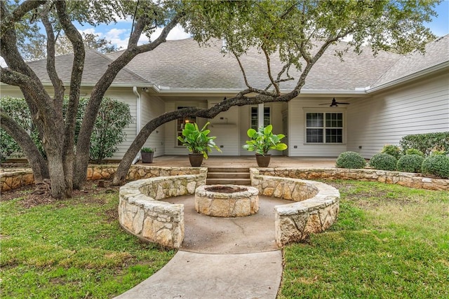 exterior space with ceiling fan