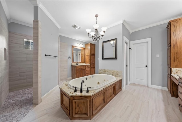 bathroom with vanity, independent shower and bath, a notable chandelier, and ornamental molding