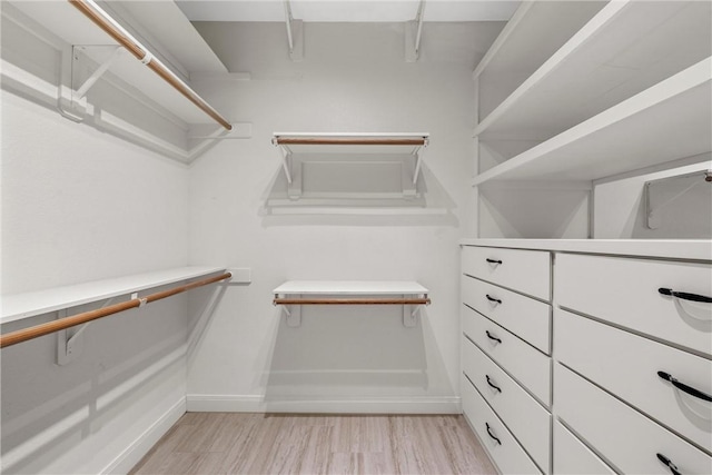 walk in closet featuring light hardwood / wood-style floors