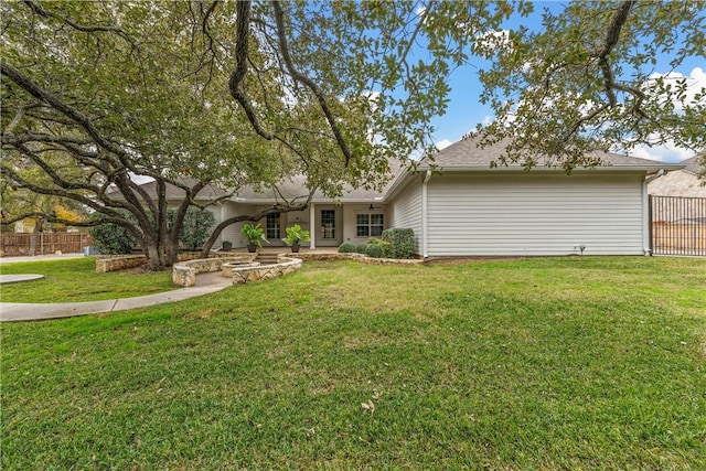 ranch-style home with a front lawn