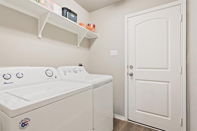 washroom featuring laundry area, dark wood-style flooring, and independent washer and dryer