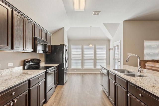 kitchen with electric stove, vaulted ceiling, a sink, black microwave, and dishwasher