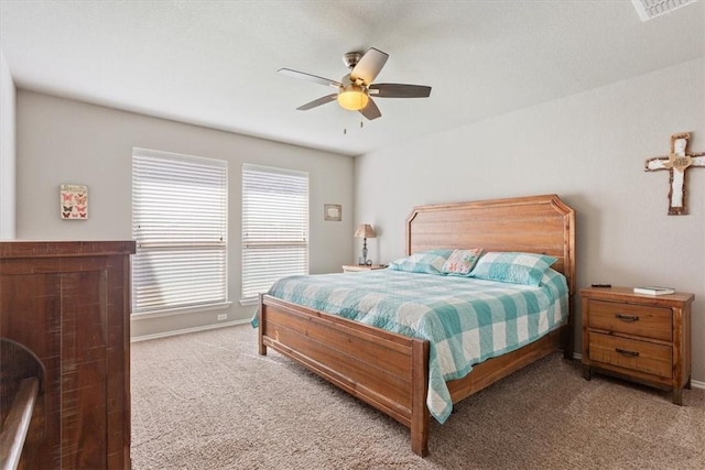 bedroom with carpet, visible vents, ceiling fan, and baseboards