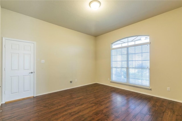 empty room featuring dark hardwood / wood-style floors