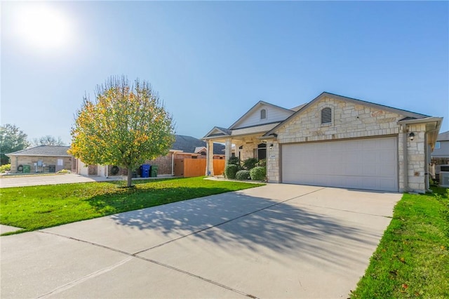 view of front of house featuring a garage and a front yard