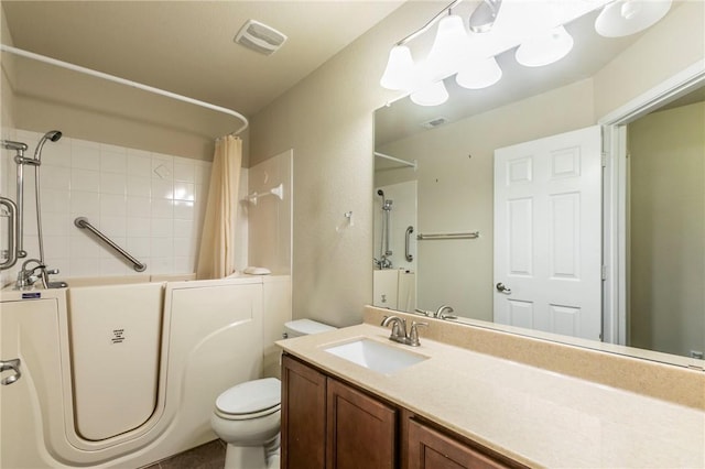 full bathroom featuring vanity, toilet, and shower / tub combo