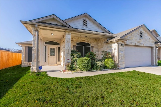 view of front of house with a garage and a front yard