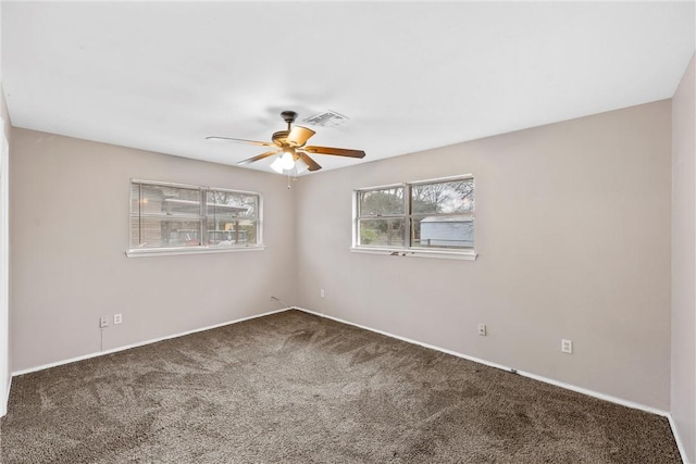 carpeted empty room with ceiling fan