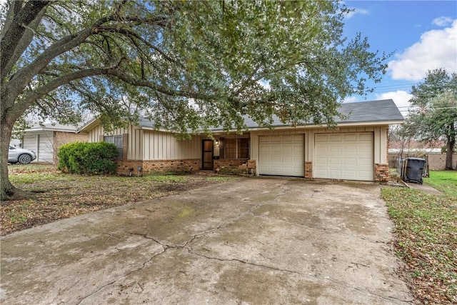 ranch-style home featuring a garage