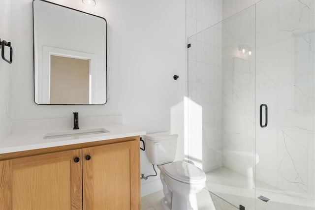 bathroom featuring tile patterned flooring, vanity, toilet, and an enclosed shower