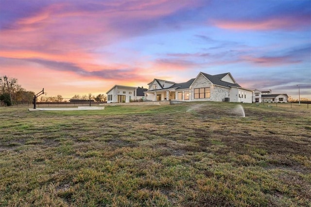 view of front of home featuring a yard