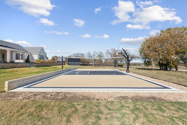 view of sport court with volleyball court and a yard