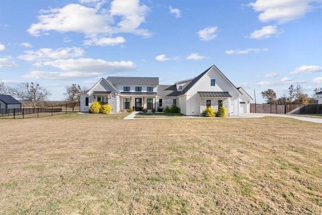 view of front facade featuring a front yard and a garage