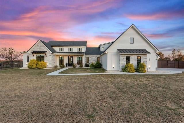 view of front of home with a yard