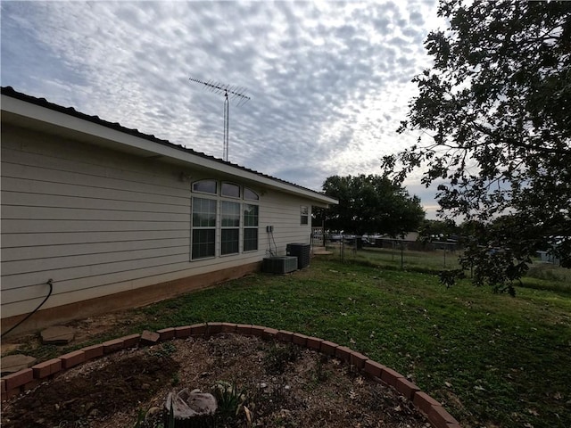 view of yard with central AC unit