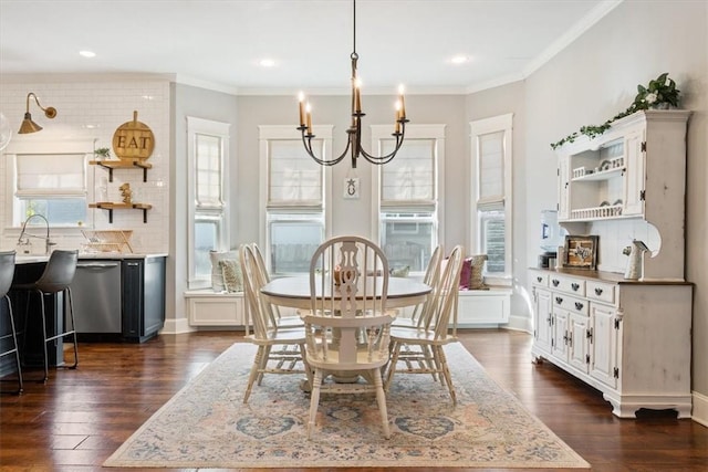 dining room with an inviting chandelier, dark wood-type flooring, and ornamental molding