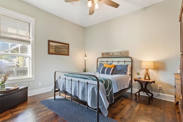 bedroom featuring dark hardwood / wood-style floors and ceiling fan