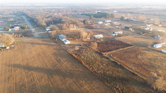 birds eye view of property featuring a rural view