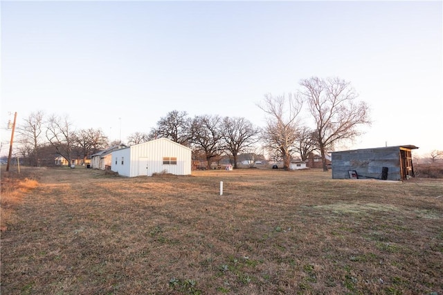 view of yard with an outbuilding and an outdoor structure