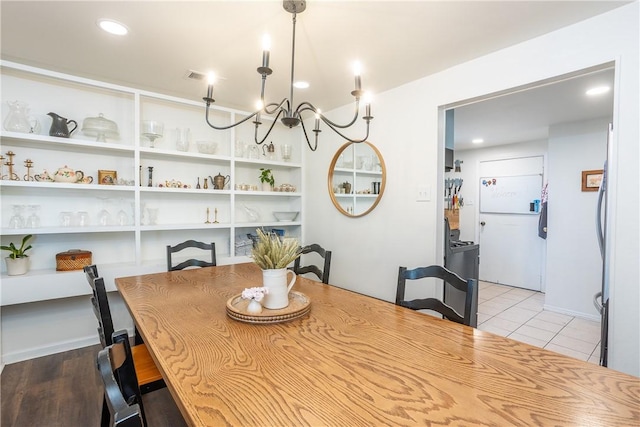 tiled dining area featuring recessed lighting and visible vents