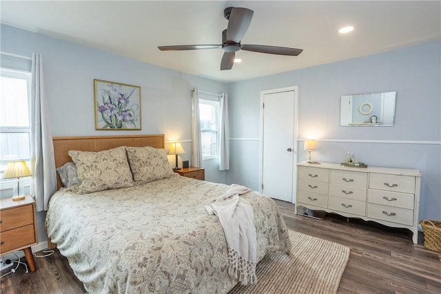 bedroom with dark wood-type flooring and a ceiling fan