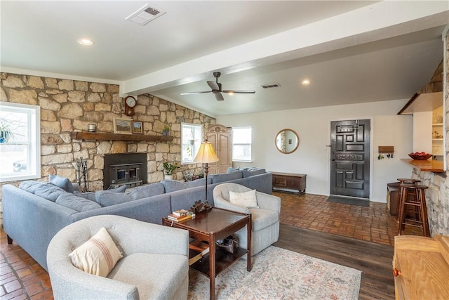 living room featuring brick floor, visible vents, a ceiling fan, and recessed lighting