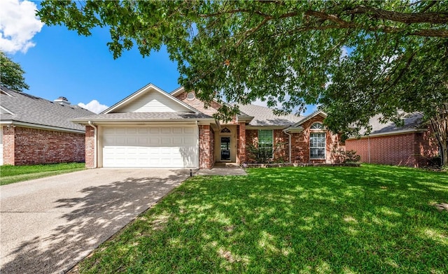 ranch-style home with a garage and a front lawn