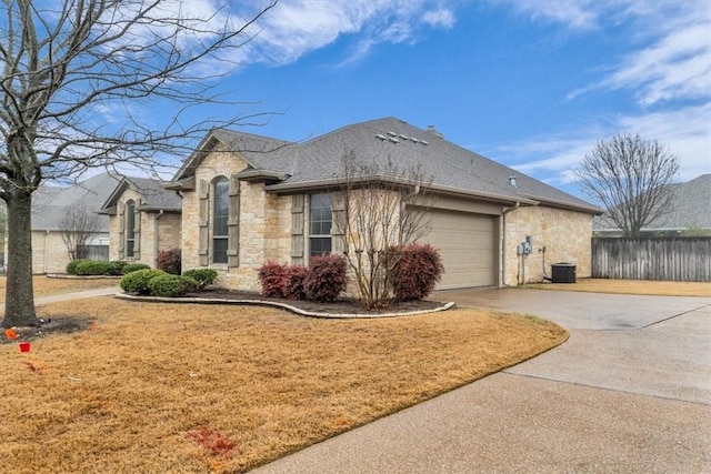 view of home's exterior with a garage and central AC