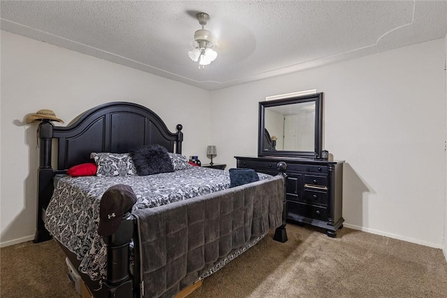 carpeted bedroom with a textured ceiling and ceiling fan